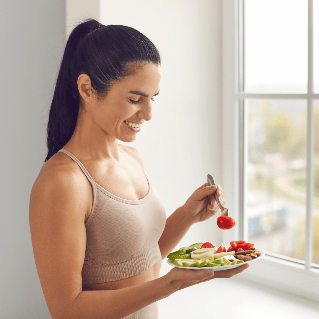 Healthy woman enjoying a Paleo or whole 30 meal without bread