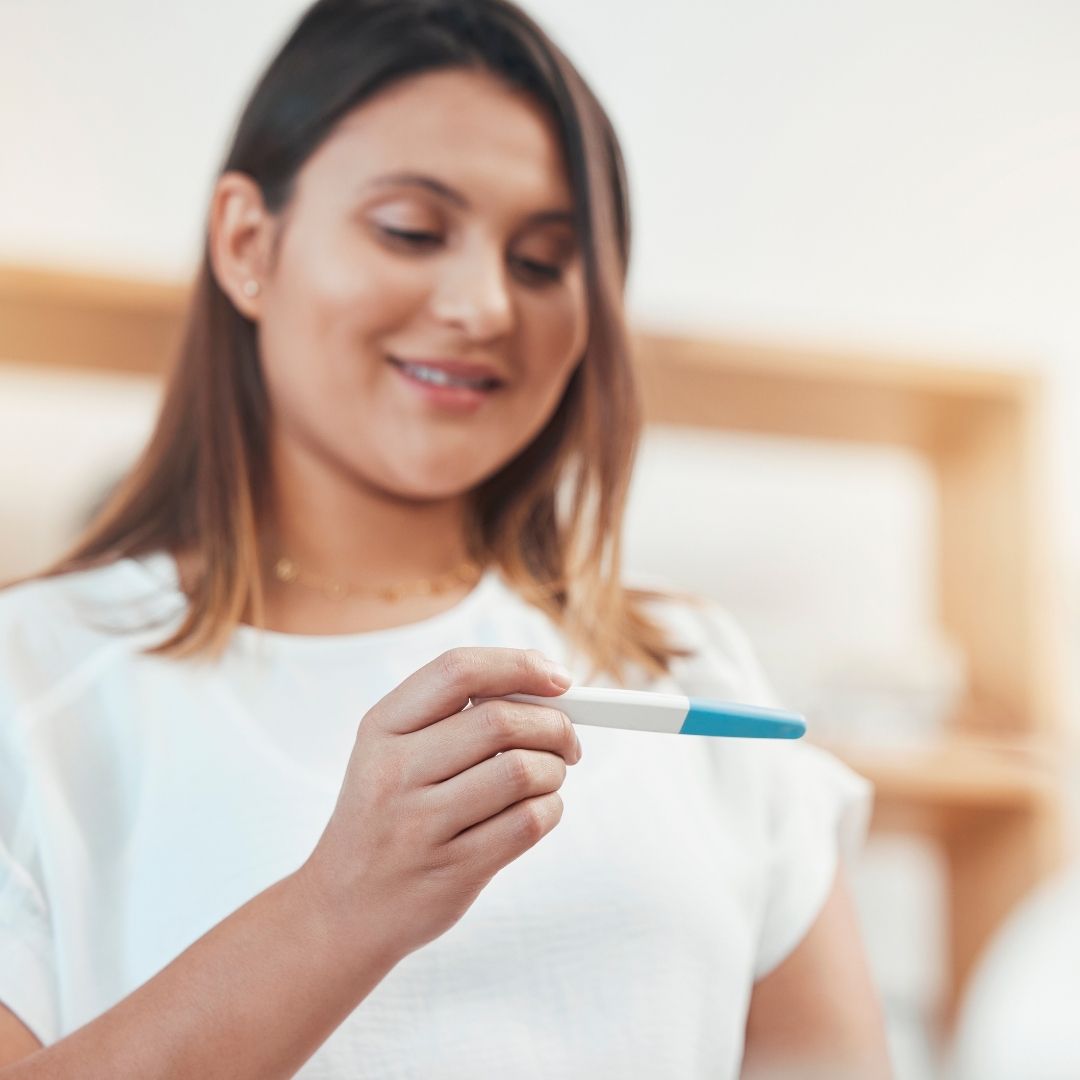 A woman tracking her menstrual cycle calendar