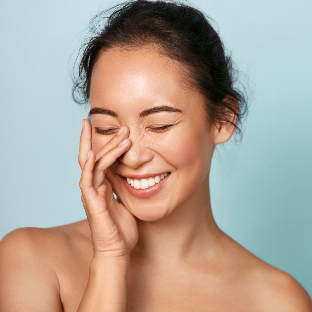A woman feeling nourished while doing a liver cleanse