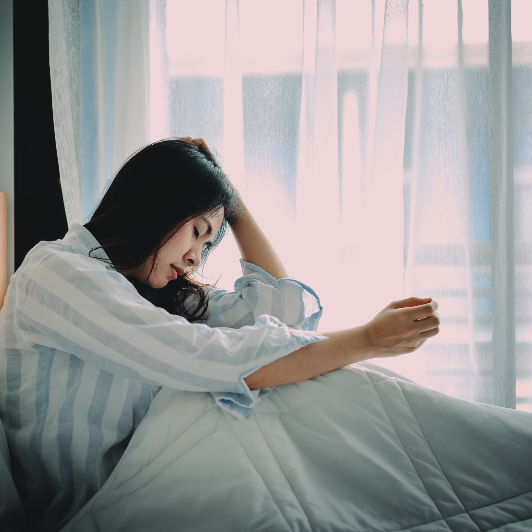 Woman with chronic inflammation and pain resting in bed